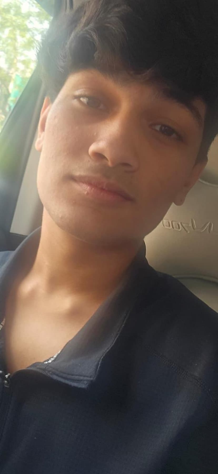 Darsh in a car, unimpressed