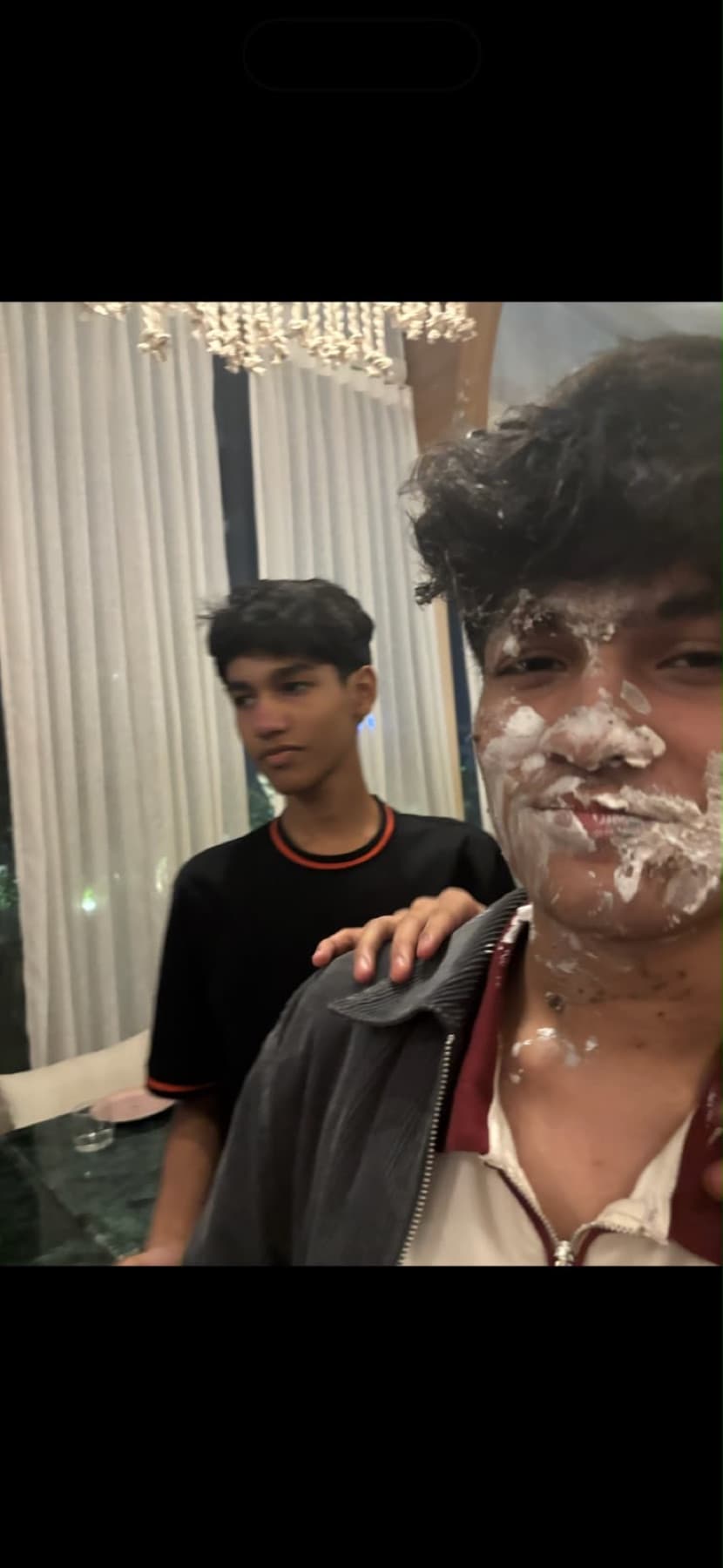 Darsh with cream on his face next to a friend