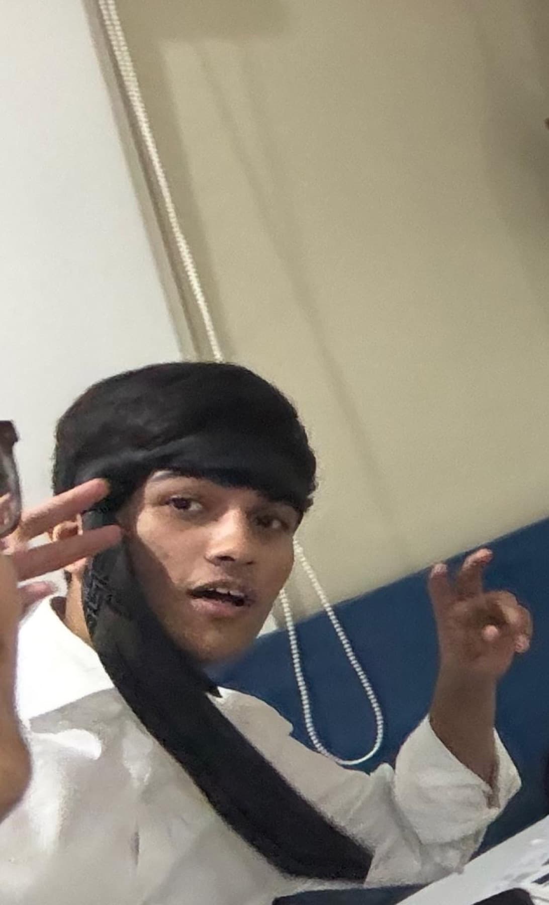 Darsh wearing a headband over his face